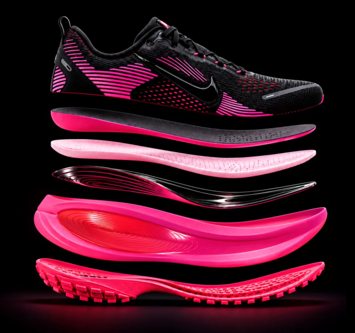 Running shoe separated into its six layers: upper, sockliner, two foam layers, rocker plate and outsole